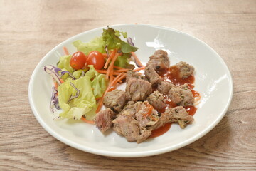 grilled slice beef ribeye steak dressing spicy barbecue sauce with salad on plate