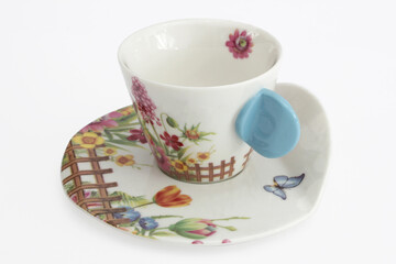  Porcelain mug with a floral pattern.