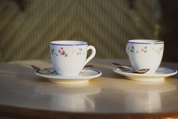 Two cups of espresso coffee on a coffee shop terrace from Paris, France.