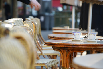 Two cups of espresso coffee on a coffee shop terrace from Paris, France.