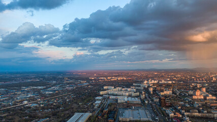 Fototapeta premium Khabarovsk city top view sunset beautiful clouds in the rain