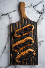 Eclairs with poppy seeds and cream. Top view. Free space for text