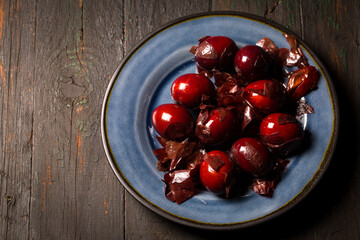 Chicken eggs with onion, husks in the old traditional method, on a big blue plate