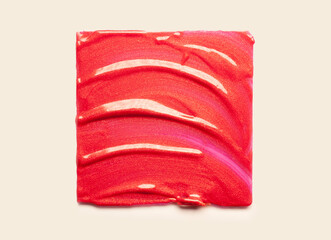 Lipstick red metallic shimmer balm lip gloss swatch isolated on white background