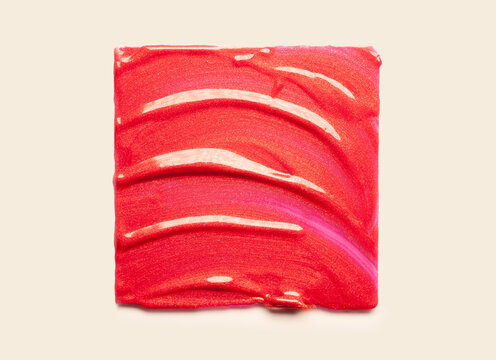 Lipstick red metallic shimmer balm lip gloss swatch isolated on white background