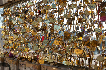 locks. padlocks hanging on a fence where people put their wishes. love.