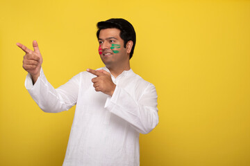 Young man celebrating holi 