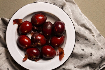 painted red eggs in a metal bowl