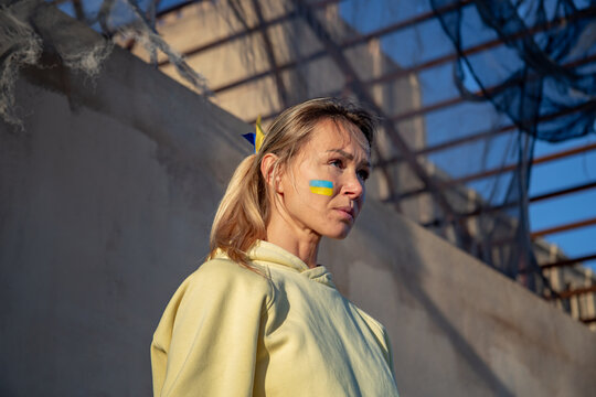 Ukrainian woman with a flag on the cheek 
