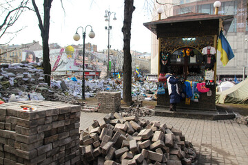 Kyiv, Ukraine - 8th of March, 2014: City center with piles of pavement stones and tires not far...