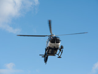 Lviv, Ukraine - 02.18.2022: Police helicopter during flight on the sky background