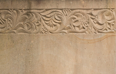 The stone surface with an interesting carved pattern