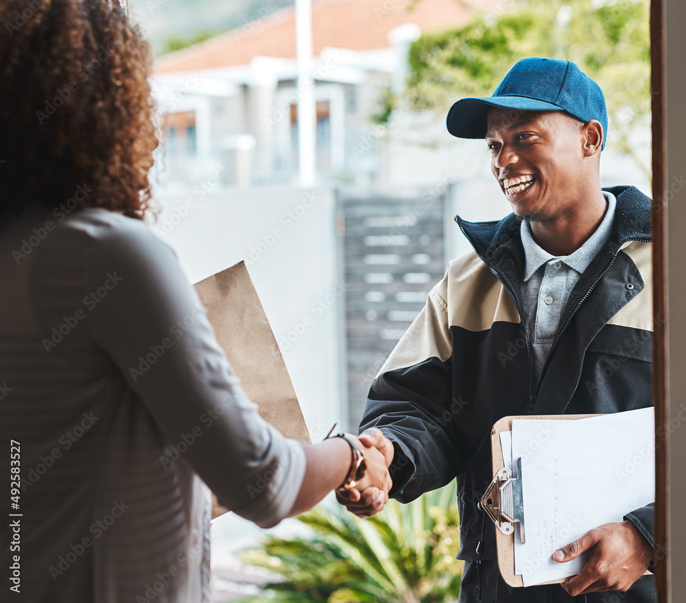 Poster hope youll make use of our services again. shot of a courier shaking hands with a customer while mak