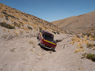 Driving through impossibly difficult roads in the Atacama desert, Chile, near the border with...