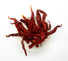 Dried pepper chillies isolated on white background.
