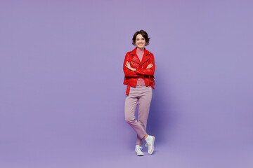 Fototapeta na wymiar Full body young smiling happy confident woman 20s wear red leather jacket hold hands crossed folded isolated on plain pastel light purple background studio portrait. People lifestyle fashion concept.