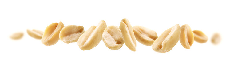 Peeled peanuts levitate on a white background