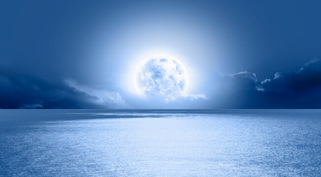 Night sky with moon in the clouds "Elements of this image furnished by NASA