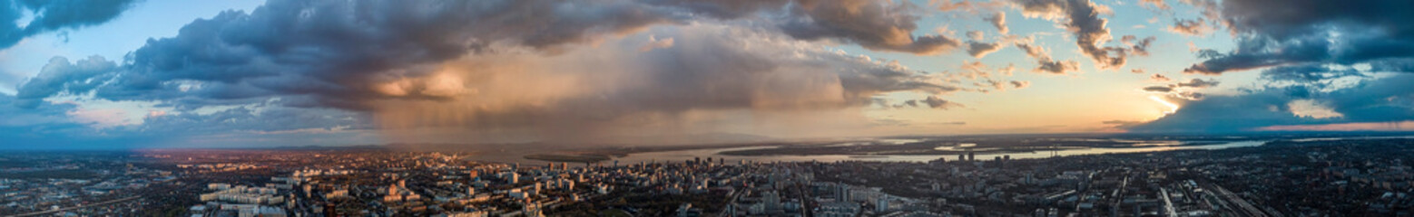 panorama Khabarovsk city top view sunset beautiful clouds in the rain
