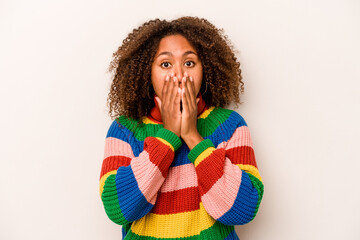 Young African American woman isolated on white background shocked, covering mouth with hands,...