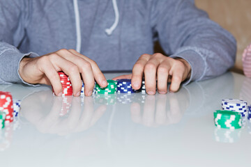 Poker game concept with chips, cards on the table. Enjoying the moment, digital detox with friends. Selective focus.