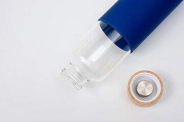 Stylish glass water bottle with wooden lid. For fitness and travel.