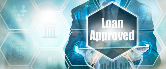 A Loan Approved business word concept on a futuristic blue display.