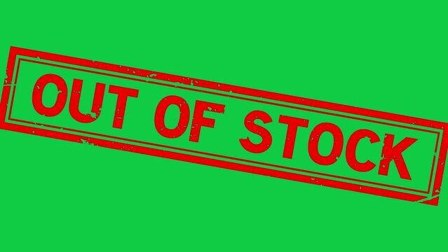 Grunge red out of stock word rubber stamp zoom on green background