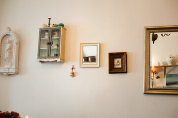 interior decorated with vintage frames and mirrors