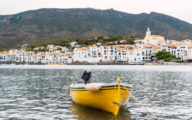 Yellow boat in the fishing village of Cadaques on the Mediterranean coast, Costa Brava, Catalonia,...