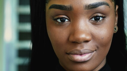 Portrait of a black latina girl face close-up looking at camera