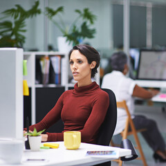 Getting right down to business. Shot of a young businesswoman and her colleagues working in their office.