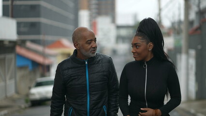 Father congratulating daughter proud dad walks with a teen daughter together