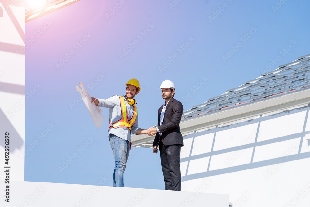 Aufkleber contractor and engineer with blueprints inspecting material a building site,new house builder.