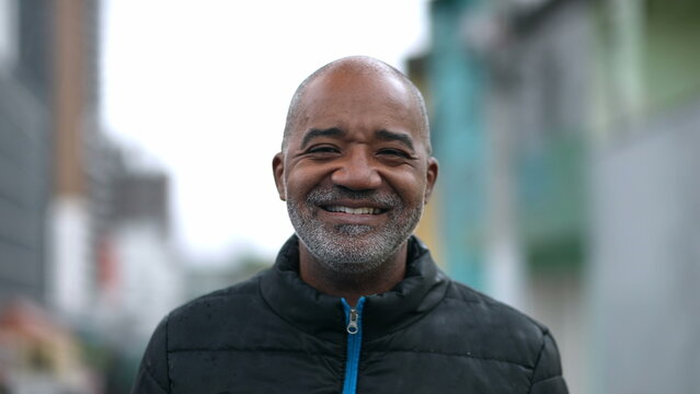 A Happy Senior Black Man Portrait Face Smiling At Camera Standing Outside In Street