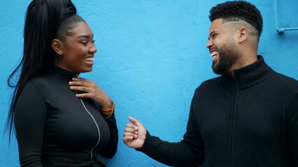Two friends laughing and smiling hanging out together