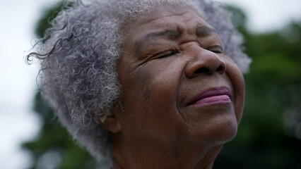 Senior woman closing eyes in contemplation