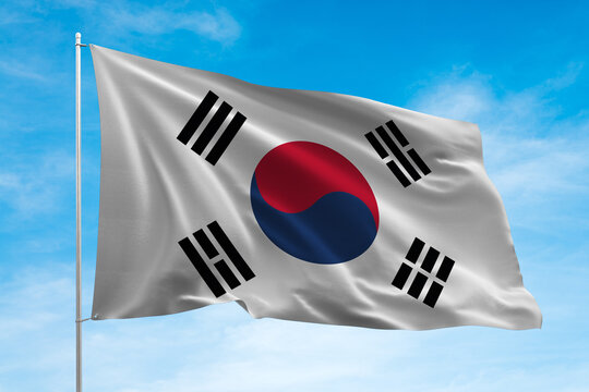 North Korea flag waving in the blue sky. 3D illustration. 3D rendering.
