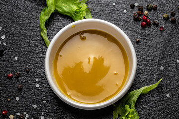 Fresh homemade organic mustard and honey sauce on a dark background, Food recipe background. Close up