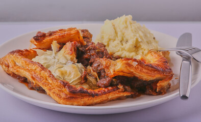 Beef and ale pie with mashed potatoes.