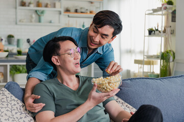 Asian gay couple happy and having romantic moment together at home