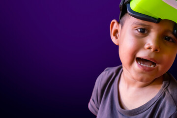 Latin boy experiencing the metaverse using virtual reality goggles