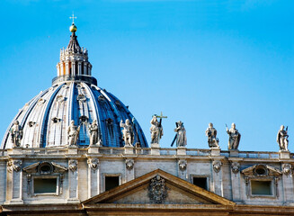 Close-up of the roof with the Apostles statues along the façade of St. Peter's Basilica, Rome, Italy.