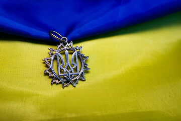Ukrainian national emblem trident on the yellow-blue  waving flag