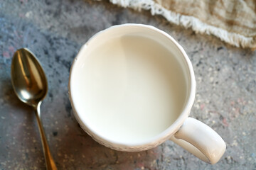 Probiotic kefir in a white cup, top view