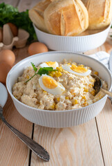 Tuna salad with mayonnaise, eggs, onions and corn in a bowl