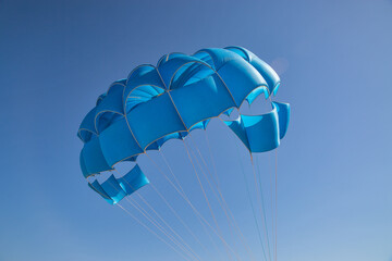 Blue open parachute for paragliding watersports
