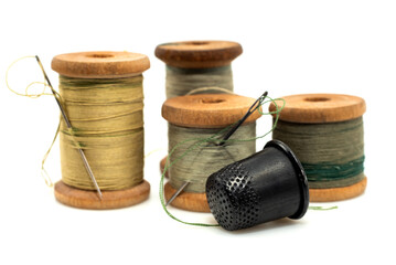 Vintage retro spool of thread on a white background. Needle with thread isolate