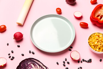 Composition with ingredients for Mexican vegetable salad on pink background