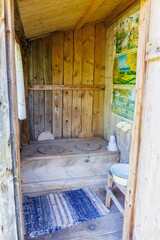 Old-fashioned outhouse in the countryside